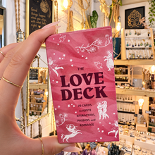 Load image into Gallery viewer, The Love Deck pink oracle box held in the hand in the shop - Let's Jam, Camden Market
