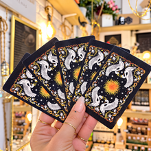Load image into Gallery viewer, Fan of Solar Kingdom card backs with their gold sun design - Let's Jam, Camden Market, London
