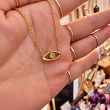 Load image into Gallery viewer, Dainty gold eye pendant resting in the palm - Let's Jam, Camden Town
