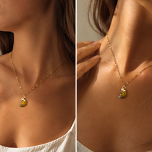 Load image into Gallery viewer, Woman wearing a gold chain necklace with a tiger's eye crystal moon crescent pendant - Let's Jam, Camden Market London
