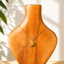 Load image into Gallery viewer, Close-up of the tiger's eye crescent moon pendant on its fine gold chain - Let's Jam jewellery, Camden Market
