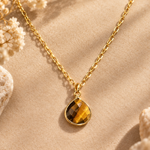Load image into Gallery viewer, Polished tiger's eye pendant in a gold setting on a chain - Let's Jam, Camden Town
