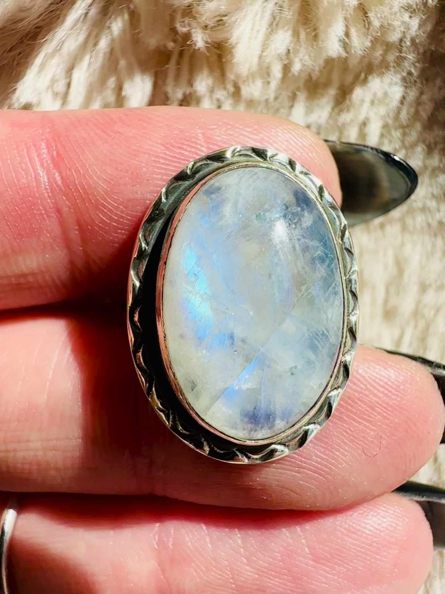Video of the moonstone sterling silver ring, round cabochon, rope trim, turning in the light - Let's Jam, Camden Market London