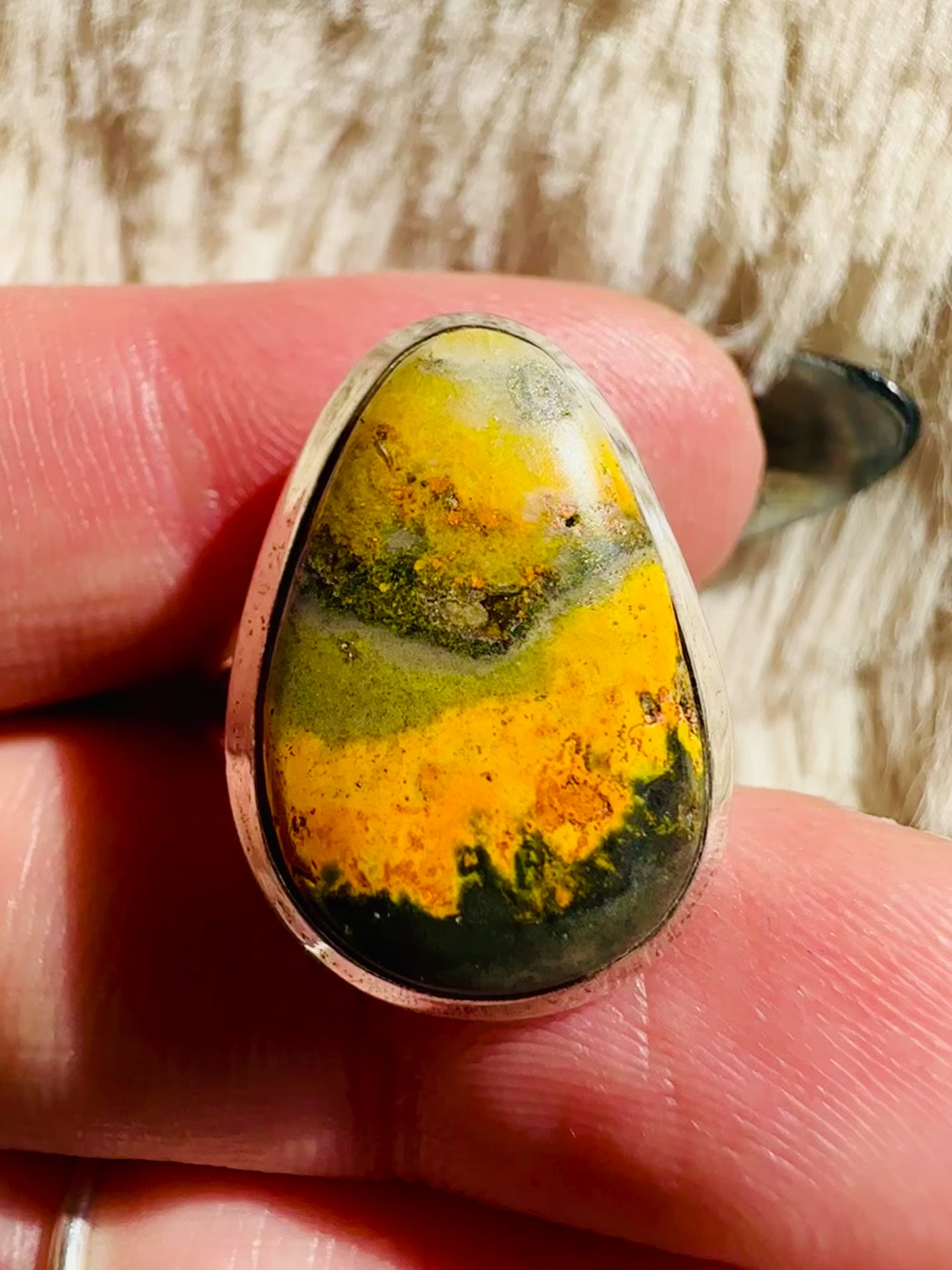 Handmade 925 sterling silver ring with an egg-shaped bumblebee jasper cabochon showing layered orange, yellow and olive-green banding, simple silver bezel, one-of-a-kind gemstone ring - Let's Jam jewellery collection