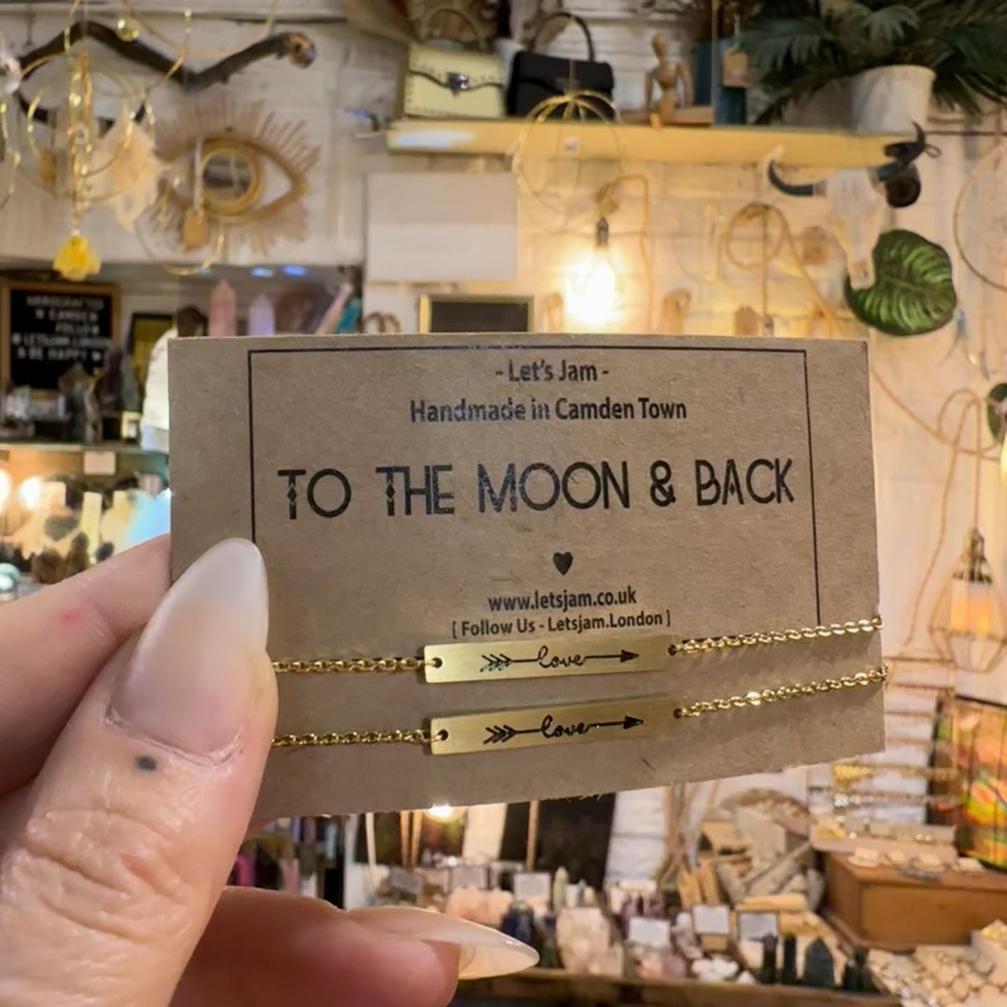 Video of the Let's Jam "To The Moon & Back" matching bracelets, two gold chain bracelets on their card - Let's Jam, Camden Market, London