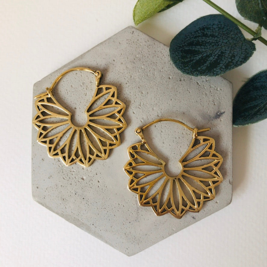 Pair of gold petal drop earrings laid side by side - Let's Jam, Camden Market, London