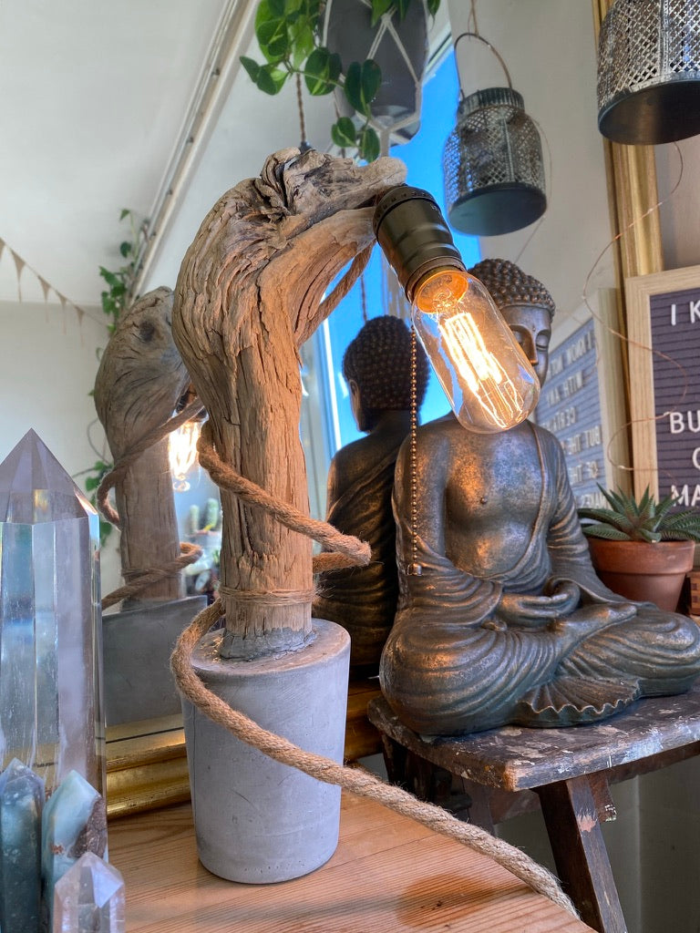 One-off handmade concrete lamp with a curved wooden branch holding a filament bulb - Let's Jam lamps, Camden Market