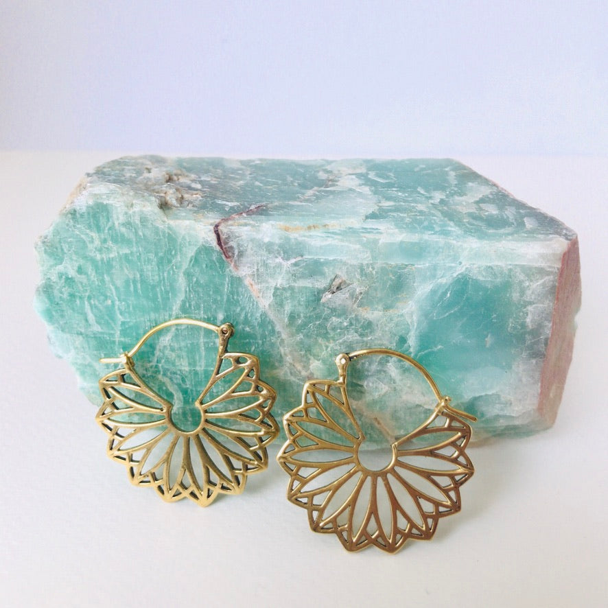 Angled view of a large petal shaped filigree earring - Let's Jam jewellery, Camden Market London