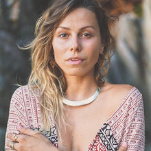 Load image into Gallery viewer, A bold silver-tone choker necklace worn close to the neck, shown on a model with tousled hair and boho-print clothing - Let's Jam jewellery collection
