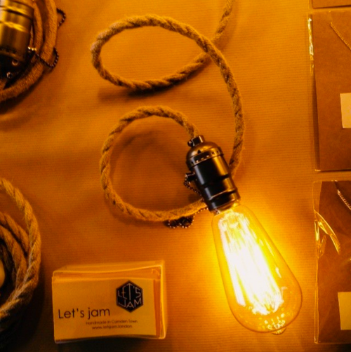 Square filament bulb lit in a darkened room - Let's Jam lighting, Camden Market, London