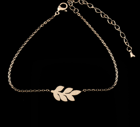 Close-up of the small leaf charm hanging from its chain - Let's Jam jewellery, Camden Market, London