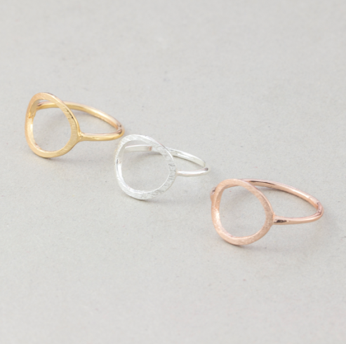 Minimalist open-circle rings shown stacked in gold, silver and rose gold on a thin band - Let's Jam jewellery collection