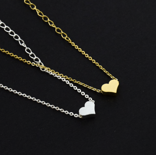 Small heart charm bracelet on a fine chain, laid flat - Let's Jam, Camden Market