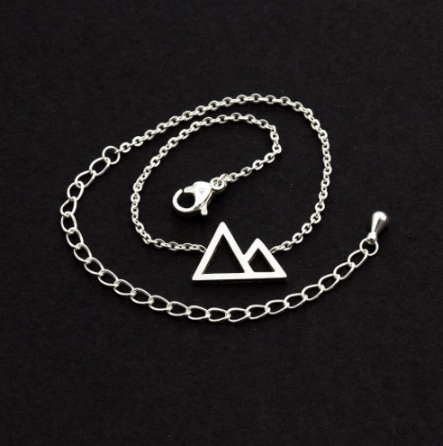 Silver mountain peaks charm bracelet laid flat - Let's Jam jewellery, Camden Town London