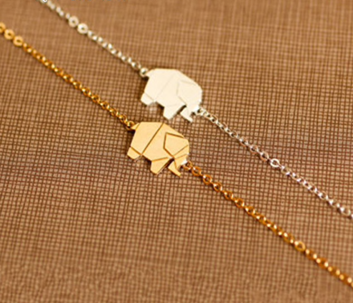 Silver folded-paper style elephant bracelet laid flat - Let's Jam jewellery, Camden Town