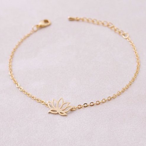 Silver lotus charm bracelet laid flat, petals open - Let's Jam jewellery, Camden Market