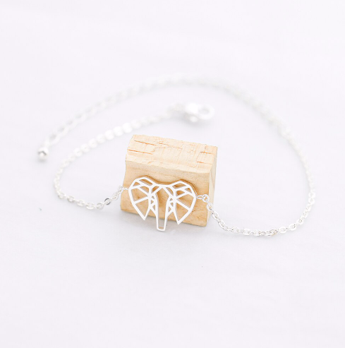 Side view of the geometric elephant pendant hanging from its chain - Let's Jam, Camden Town
