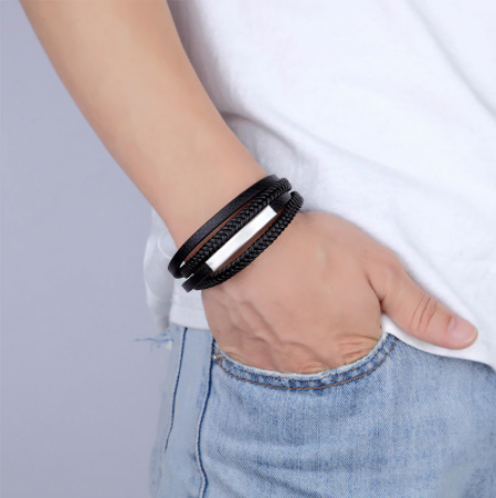 Close-up of the gold magnetic bar clasp on a black leather men's bracelet - Let's Jam jewellery, Camden Town