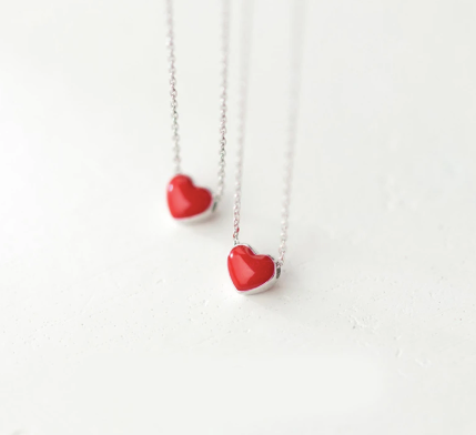 Red heart necklace worn on the neck at the shorter chain length - Let's Jam, Camden Town
