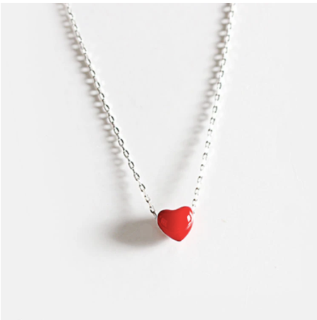 Glossy red enamel heart pendant on a fine 925 sterling silver chain, shown close up - Let's Jam jewellery, Camden Market