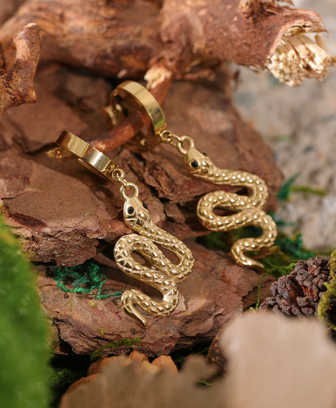 Gold-plated steel snake earring curving down beside the neck - Let's Jam jewellery, Camden Market, London