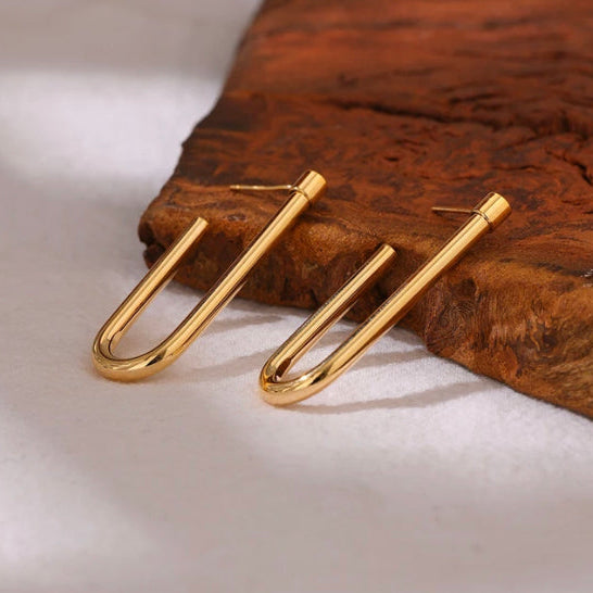 Gold U earrings worn with a striped blazer, catching the light - Let's Jam, Camden Market, London