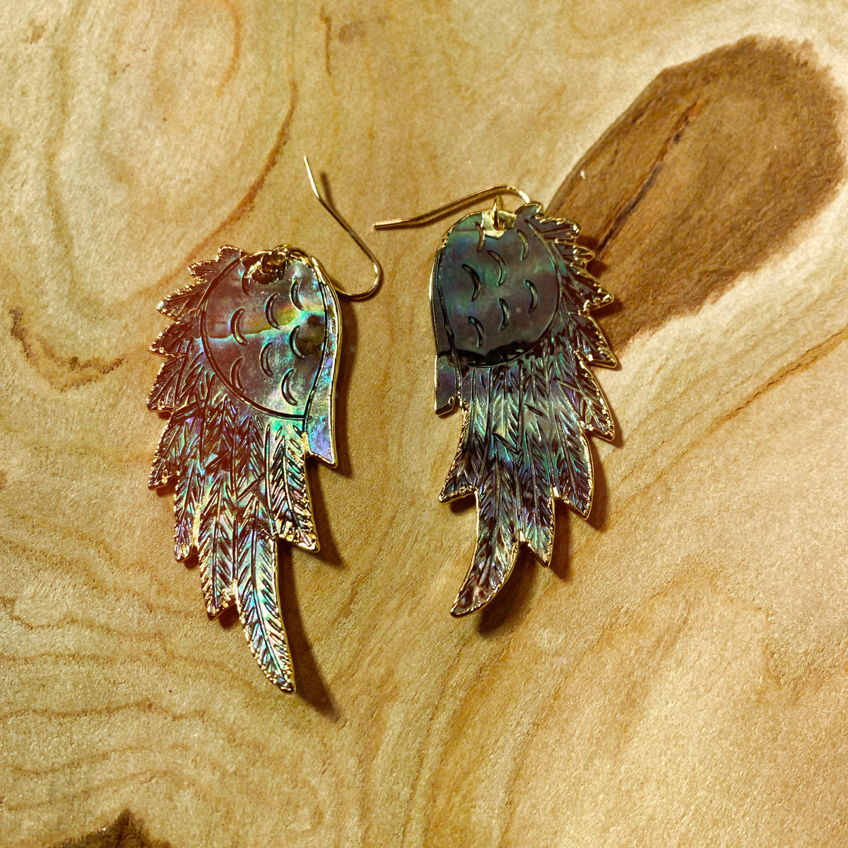 Hand-carved abalone shell wing earrings on wood, blue-green shimmer - Let's Jam jewellery, Camden Town