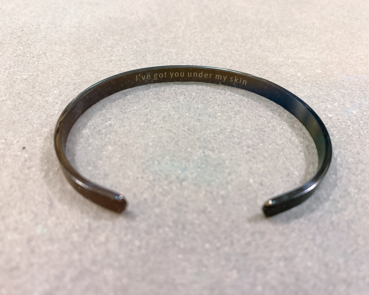Open cuff bracelet in polished stainless steel, side view - Let's Jam jewellery, Camden Market, London