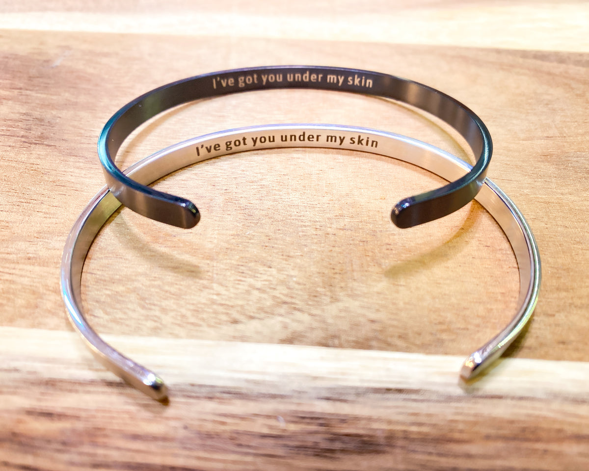 Hidden engraving cuff bracelet worn on the wrist - Let's Jam jewellery, Camden Market