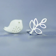 Load image into Gallery viewer, 925 sterling silver mismatched bird and twig stud earrings on a lilac background - Let's Jam jewellery collection
