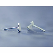 Load image into Gallery viewer, Silver twig stud earring paired with a small bird design - Let's Jam, Camden Market
