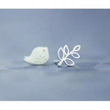 Load image into Gallery viewer, Mismatched bird and branch studs worn on the ear - Let's Jam jewellery, Camden Town

