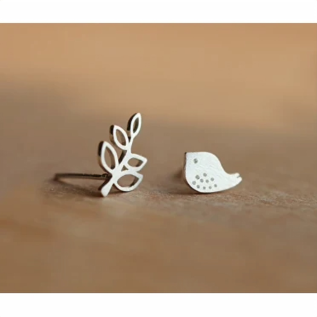Pair of 925 sterling silver nature studs on a plain background - Let's Jam, Camden Market London