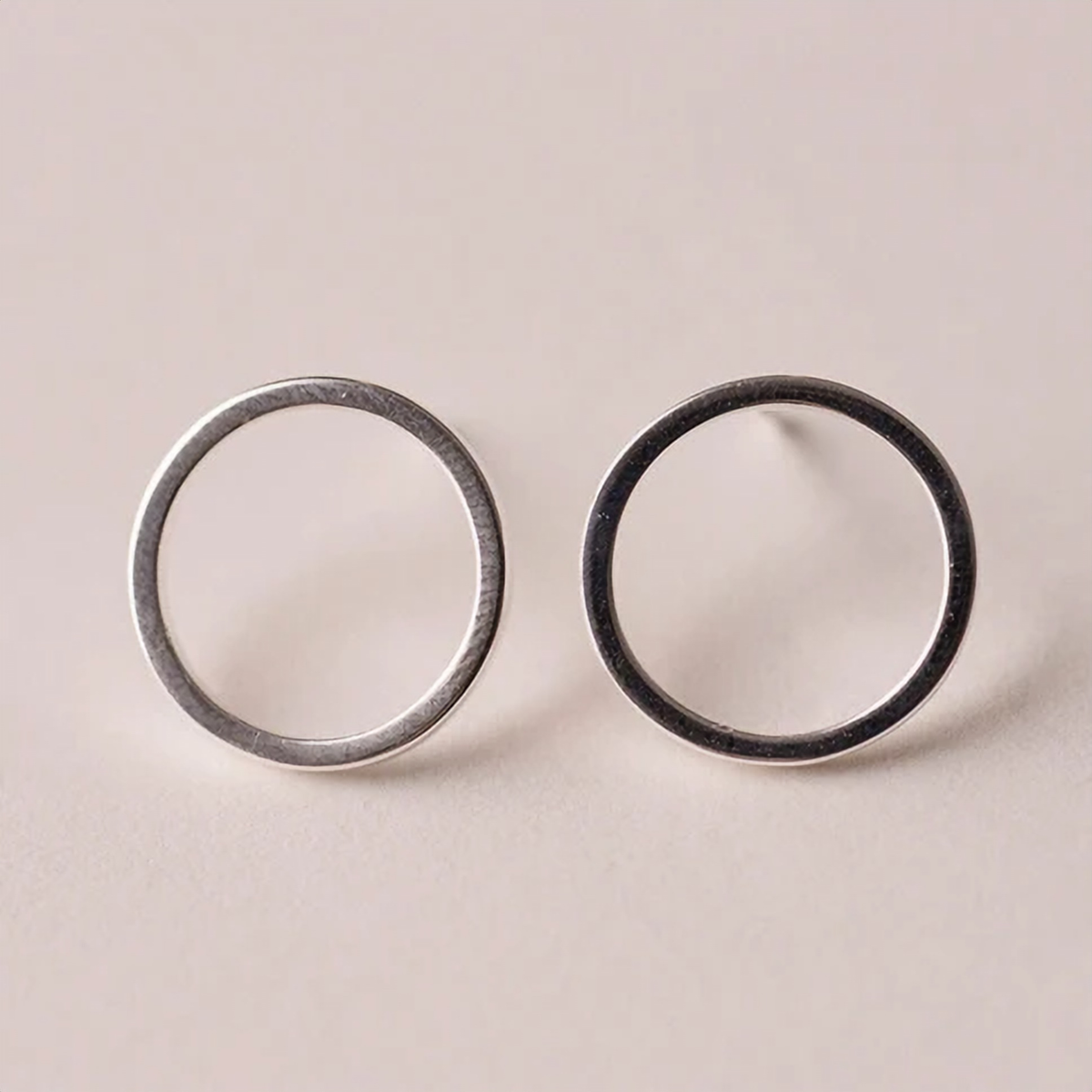 Close-up of an oxidised black circle outline stud earring - Let's Jam, Camden Town London