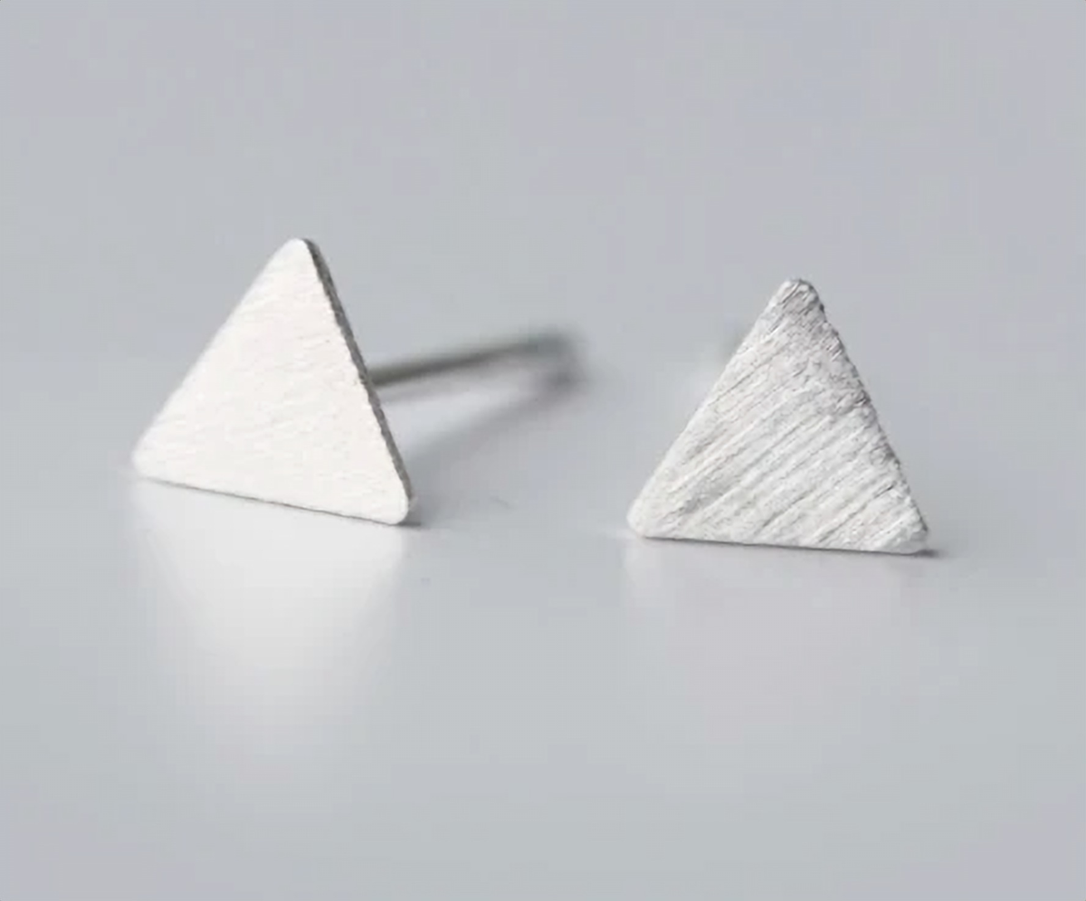 Pair of minimalist sterling silver triangle studs on a white background - Let's Jam jewellery, Camden Town